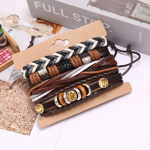Detail of vintage layered braided leather bracelets with yellow crystal and wood beads