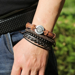 Men's multilayer leather bracelet set with Yin Yang charm and braided beads on wrist