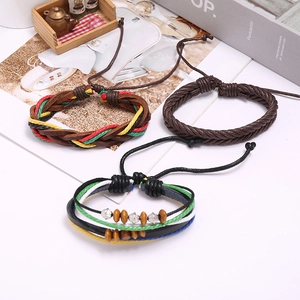 Three-piece set of vintage braided leather bracelets with colorful beads and metal accents
