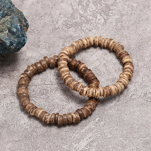Handmade coconut shell beaded bracelets with natural wood texture in vintage brown