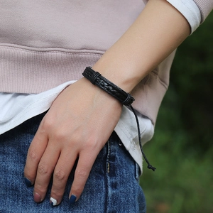Minimalist black braided leather bracelet for men and women with adjustable cord closure