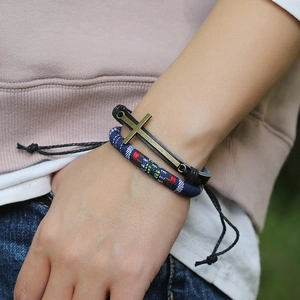 Bohemian multilayer leather bracelet with bronze cross pendant and ethnic beaded woven cord