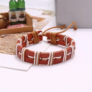 Vintage braided leather bracelet in brown with adjustable knots and woven cotton details