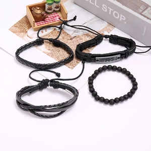 Detail of 4-piece vintage black braided leather bracelet set with hope metal plate