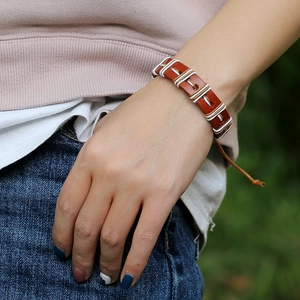 Adjustable brown braided leather bracelet for women with decorative white stitching