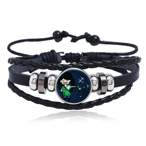 Detailed view of Sagittarius leather braided bracelet with luminous glass dome and metal beads