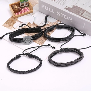 Set of four handmade black woven leather bracelets with Yin Yang metal pendant and adjustable cord
