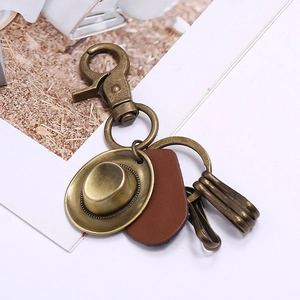 Retro cowboy hat keychain with brown leather tag and antique bronze finish metal ring
