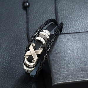 Adjustable multi-layer black leather bracelet with silver X charm and woven cord details
