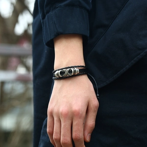 Multi-layer woven leather bracelet for men with metal X-shaped charm and adjustable cord