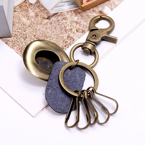Retro bronze metal keychain with blue leather tag and five small key ring hooks