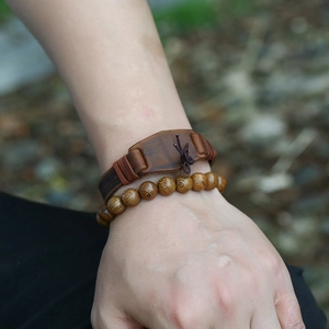 Retro brown leather cuff with cross-tie and textured wood bead bracelet set for men
