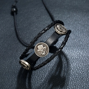 Multilayer black leather woven bracelet with vintage silver skull charms and adjustable cord