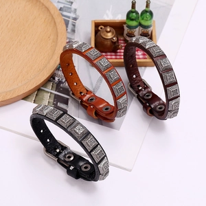 Retro punk style leather bracelet with vintage metal charms and adjustable pin buckle strap