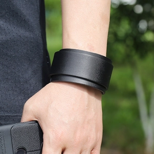 Close-up of black double-layered punk leather bracelet with textured finish for men