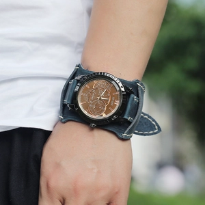 Men's vintage wide blue leather wristband watch with bronze case and white stitching