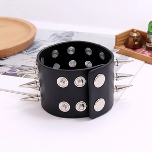 Black leather punk bracelet featuring triple rows of silver spikes and metal snap buttons