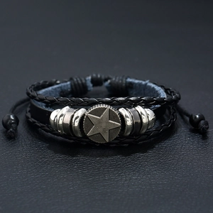 Multilayer punk leather bracelet featuring a vintage star charm and braided cords
