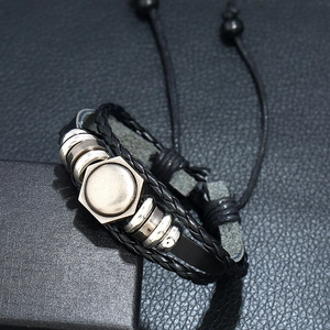 Adjustable multi-layer braided leather bracelet with vintage hexagonal metal pendant