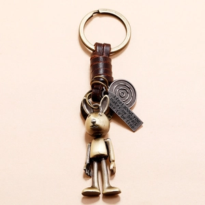 Vintage handmade bronze rabbit leather keychain with movable joints and engraved quote
