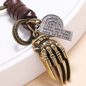 Vintage punk leather keychain featuring a bronze claw pendant and engraved metal plate
