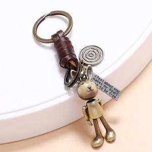 Vintage bronze rabbit keychain with woven cowhide details and movable metal joints
