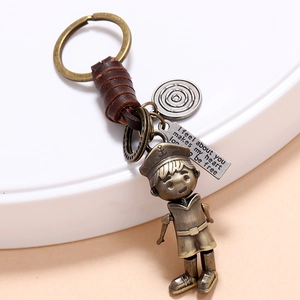 Vintage handmade leather keychain with movable bronze robot doll and engraved tag