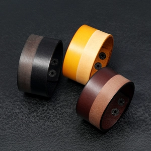 Premium wide leather cuff bracelets for men featuring dual snap buttons and contrast stitching