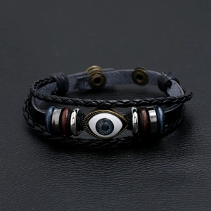 Multilayer braided leather bracelet with blue evil eye bead and retro metal accents