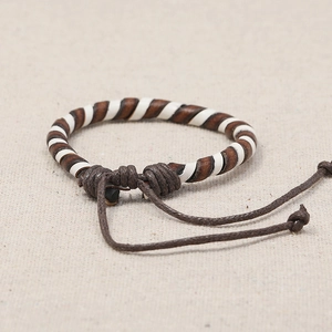 Handmade woven vintage leather bracelet for women with adjustable brown rope and spiral pattern