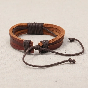 Handcrafted multilayer brown leather bracelet with adjustable cord and bohemian style