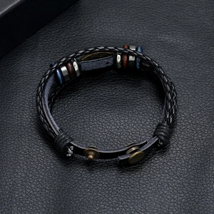 Vintage braided black leather bracelet with blue eye charm and metal beads for men and women