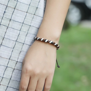 Handmade woven vintage brown leather bracelet for women with adjustable cord closure
