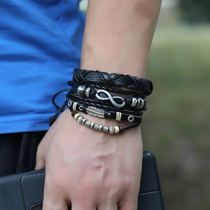 Men's retro braided leather bracelet set featuring infinity and feather metal charms