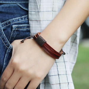 Handmade multilayer red-brown leather bracelet with woven cord and adjustable drawstring