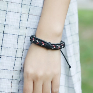 Vintage multilayer braided leather bracelet with ethnic woven pattern and adjustable cord