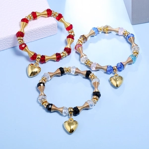 Three-piece bohemian beaded bracelet set with crystal stones and heart charms