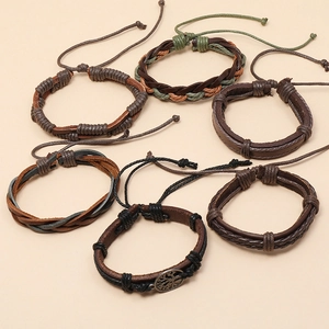 Détails d'un lot de 6 bracelets vintage en cuir tressé avec breloque arbre de vie