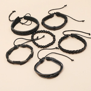 Detailed view of 6-piece black woven leather bracelet set with adjustable drawstring
