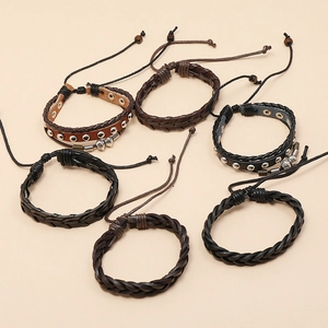 Detail showing 6-piece vintage braided leather bracelets with alloy charms and wooden beads