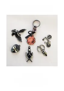 Set of retro alloy charms featuring eagle, mask, and skull with vintage silver finish