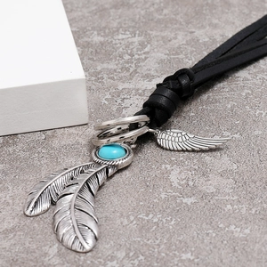 Ethnic style black leather necklace with silver feather pendant and blue stone