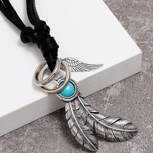 Vintage feather pendant necklace with turquoise stone on black leather cord