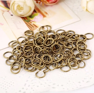 Close-up of antique bronze metal jump rings for DIY handmade jewelry crafting