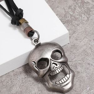 Vintage silver skull pendant with black leather cord necklace and built-in bottle opener