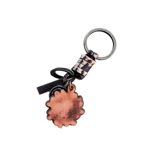 Vintage woven leather keychain with bronze metal ring and engraved gear pendant