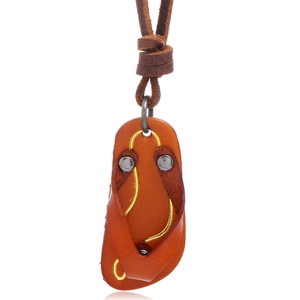 Creative brown leather flip-flop pendant necklace with vintage metal rivets on white backdrop