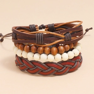 Detail of 4-piece multilayer braided leather bracelet set with wood beads and adjustable cord