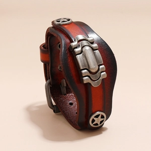 Close-up of vintage multi-layer leather bracelet with silver star studs and buckle