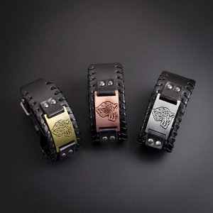 Detail of Viking wolf head leather bracelets in bronze, copper, and silver finishes